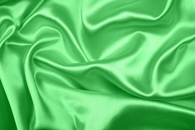 Smooth elegant green silk or satin texture can use as background, beautiful of fabric