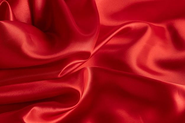 Smooth elegant red silk or satin texture can use as background