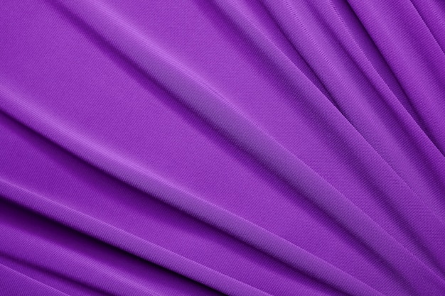 Smooth elegant violet satin texture can use as abstract background. Luxurious background design. Closeup purple texture