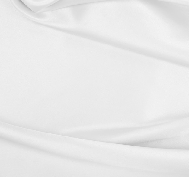 Smooth elegant white silk or satin luxury cloth texture as wedding background