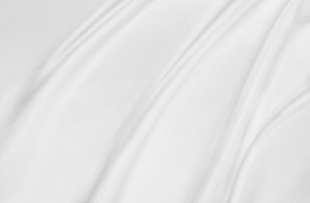 Smooth elegant white silk or satin luxury cloth texture as wedding background