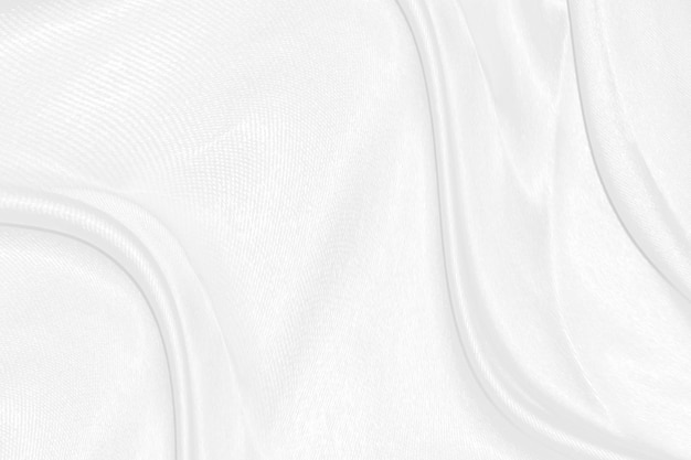 Гладкая элегантная белая шелковая или атласная роскошная текстура ткани может использоваться в качестве свадебного фона Роскошный дизайн фона