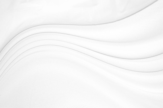 Smooth elegant white silk or satin luxury cloth texture can use as wedding background Luxurious background design