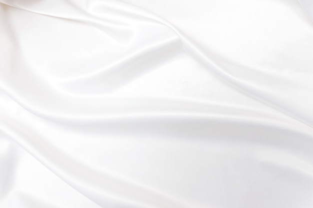 Smooth elegant white silk or satin texture. Luxurious backdrop design