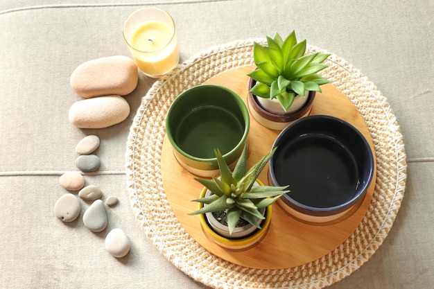 Smooth gray stones used in spa for relaxation with decorative objects