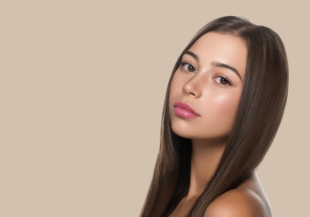 Smooth hair woman long hair beauty girl with pink lips. Color background. Brown.