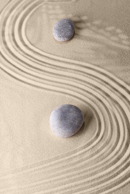 Smooth lines on the sand and round stones