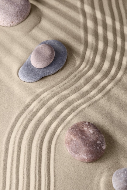 Smooth lines on the sand and round stones