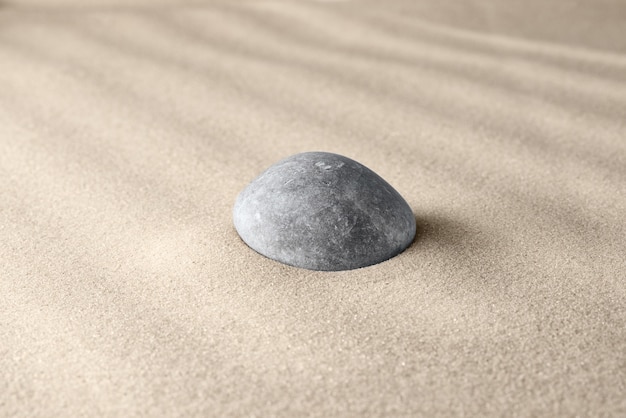 Smooth lines on the sand and round stones