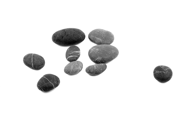 Photo smooth pebble stones isolated on white background