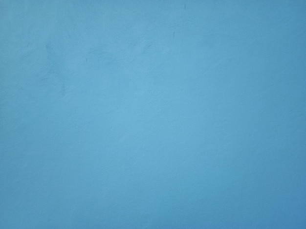 Smooth surface blue cement wall background in vintage style for graphic design or wallpaper