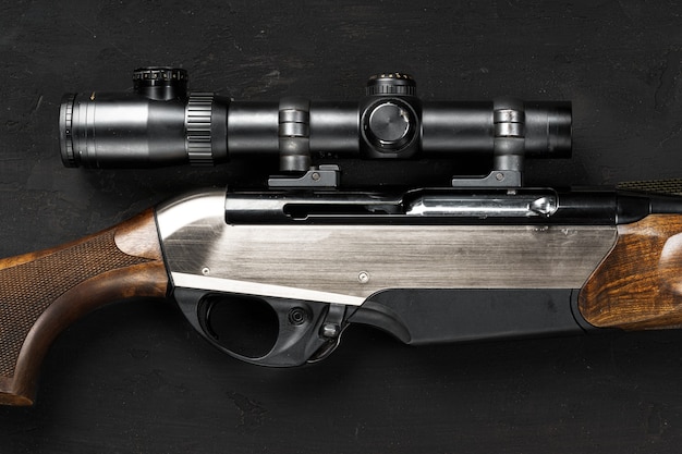 Smoothbore hunting gun on black background close up