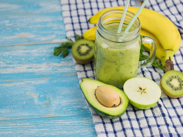 Smoothie of avocado with cut fruits of Apple, kiwi and avocado. Diet vegetarian food. Raw foods.