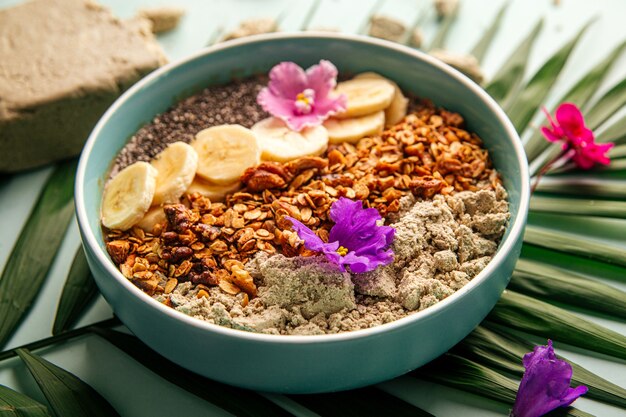 Smoothie bowl with halva bananas seeds and granola