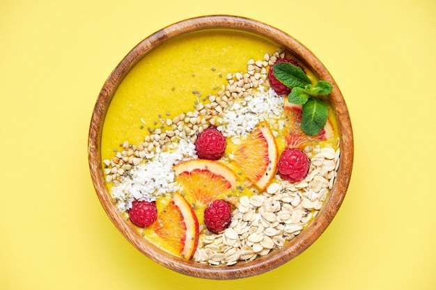 Smoothie bowls healthy breakfast bowl with chia seeds muesli berries fruits and coconut flakes