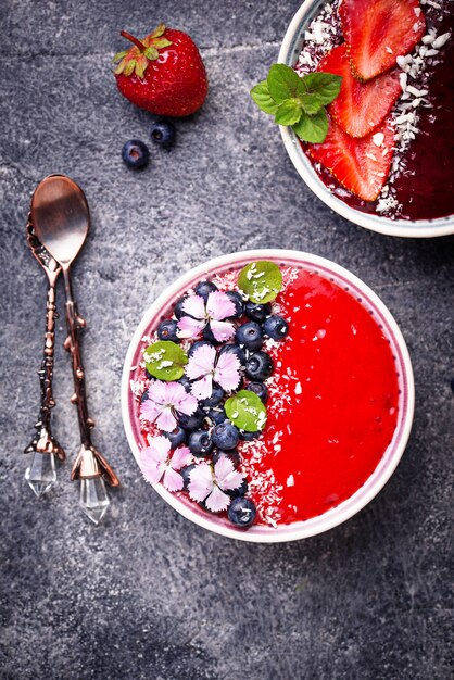 Smoothie bowls with strawberry and blueberry 