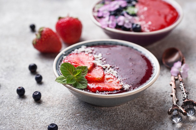 Smoothie bowls with strawberry and blueberry 