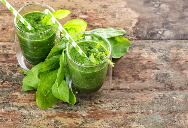 Smoothie drink with fresh green spinach leaves. Healthy food. Detox concept