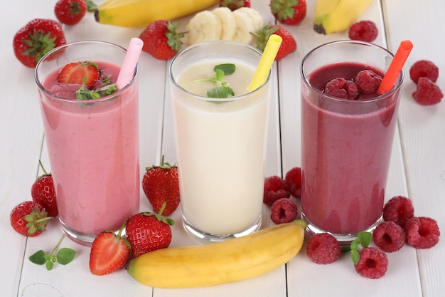 Smoothie fruit juice with fruits like strawberries raspberries and banana