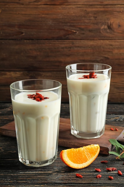 Smoothie with goji berries in glasses on table