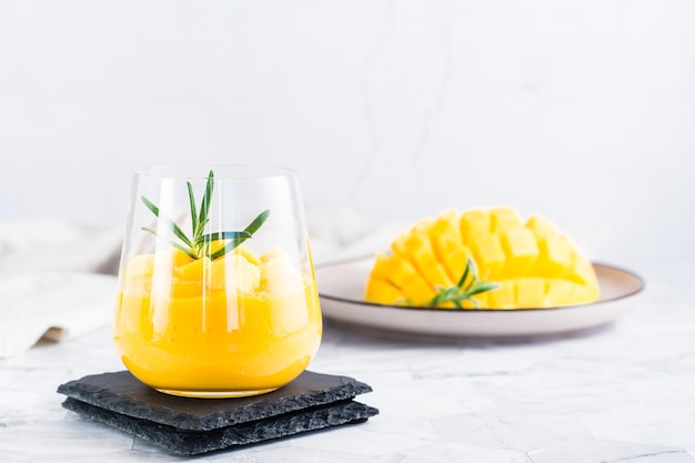 Smoothies from fresh ripe mango in glasses on the table Homemade Dessert