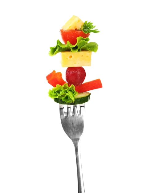 Snack of vegetables on fork isolated on white