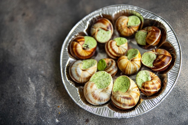 snails green garlic oil fresh healthy meal food snack on the table copy space food background