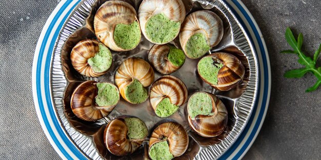 Snails green garlic oil fresh healthy meal food snack on the table copy space food background