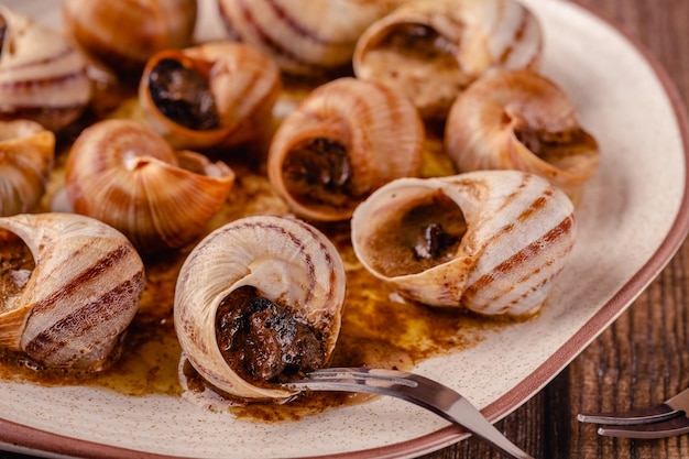 Snails with butter on a plate