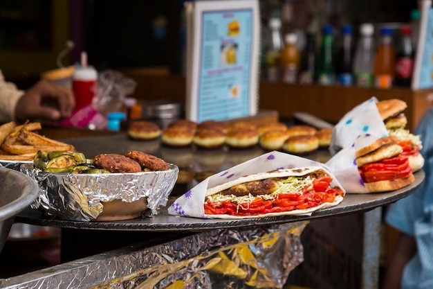 Photo snap shot of india hamburger style on hot pan in pushkar india