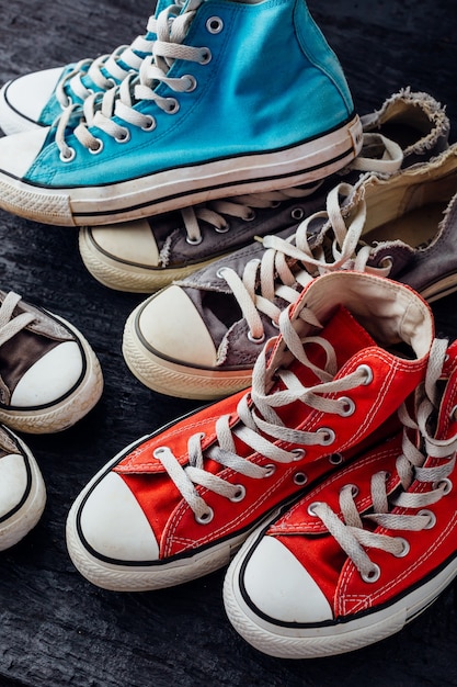 sneakers on black wooden background