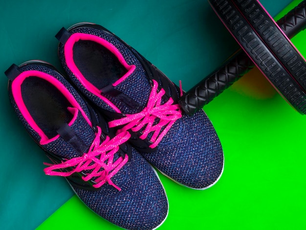 Sneakers on green background Fitness background Main sport trend concept