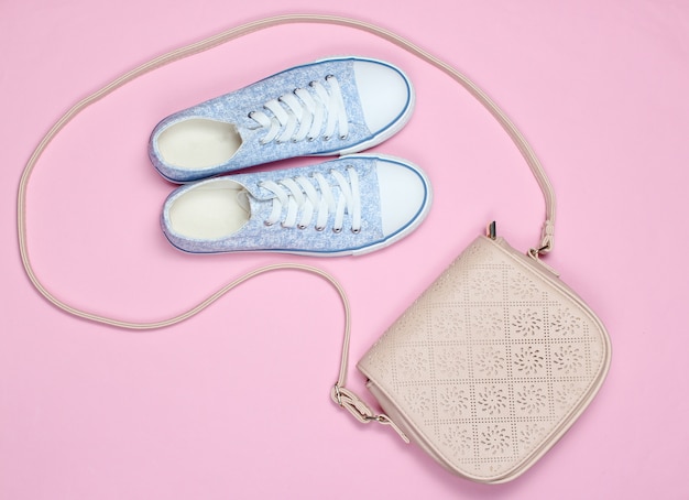 Photo sneakers, leather bag on pink