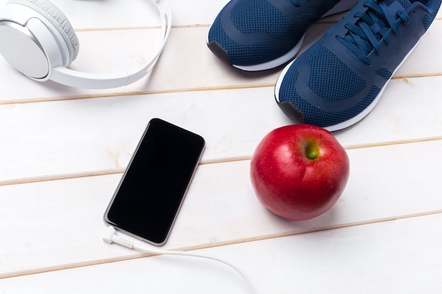 Sneakers and mobile phone with headphones