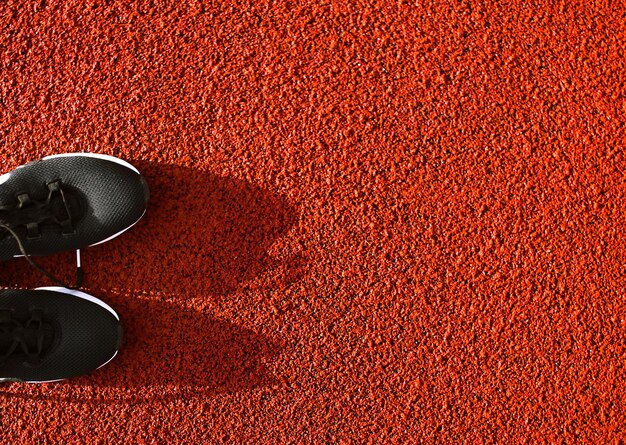 sneakers on a red line for running