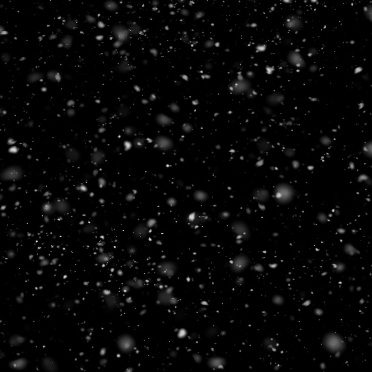 Foto sneeuw die op een zwarte achtergrond valt