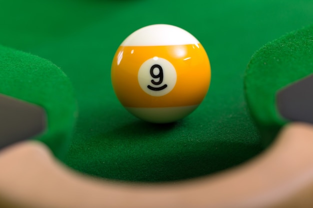 Snooker balls are placed closer to the hole on the snooker table.