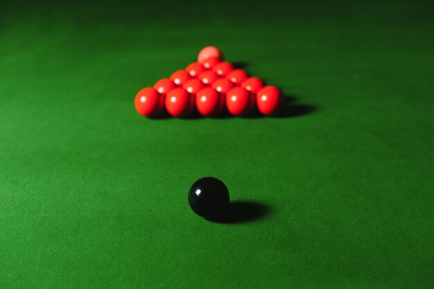 Snooker balls set on a green table