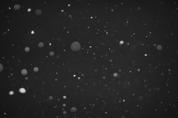 雪の背景黒の背景に雪オーバーレイ用の雪片