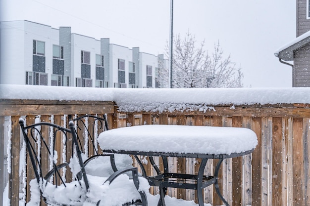 Snow on backyard fence during winter snowstorm