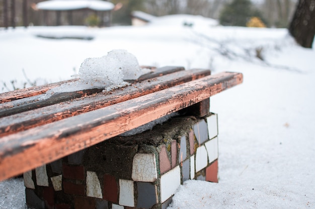 Snow bench in the park.