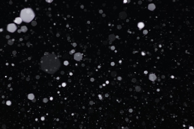 Snow on a black background. Snowflakes for overlay. Snow background.