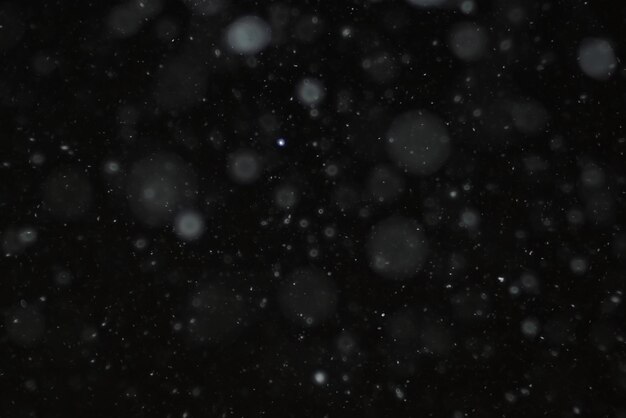 snow on a black background texture overlay bokeh highlights