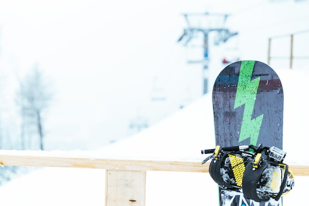 Snow board with lift on background