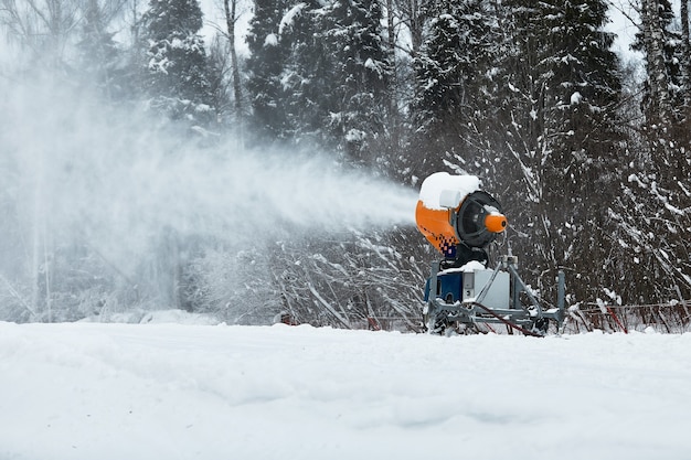 Snow cannon spraying out a fresh dusting of snow on the ski slopes.