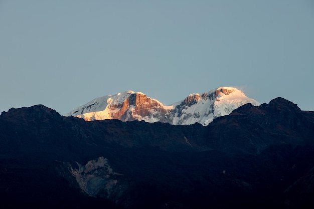 The snow capped mountains of the himalayas are visible.