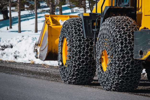 Snow chain on road maintenance machines