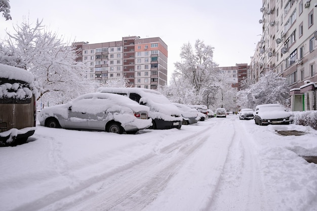 Snow collapse the city blocked the snowfall cars are in the snow the road is all covered