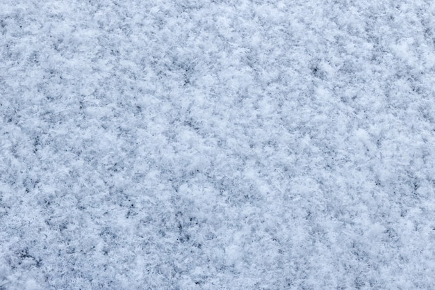 Snow covered car windshield texture and background