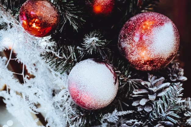 Snow covered Christmas red balls Festive concept magic Christmas and New Year holiday